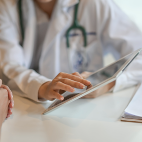 Doctor's hands using a tablet device | BCBS of Tennessee