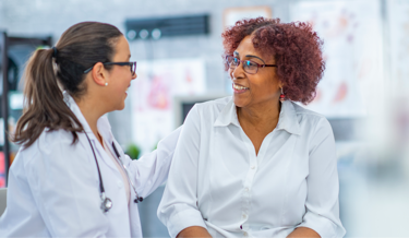 Female doctor talking to female patient| BCBS of Tennessee